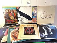 Group shot of all seven record albums in lot