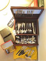 Overall view of flatware chest, accessory boxes, loose pieces