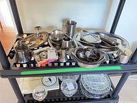 overview of all silver-tone items on shelving unit
