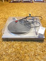 Full view of Sony PS-LX2 turntable with dust cover and cables