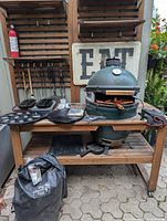 Grill in table with accessories displayed; wall tools visible
