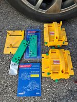 Overall view of two pushblocks, accessory plate, replacement legs pack and manual