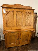 Front view of oak secretary desk closed