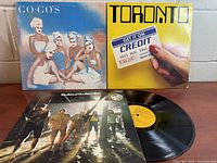 Front covers of three vinyl albums