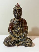 Front view showing entire seated Buddha with crackled lacquer finish