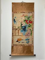 Full view of entire hanging scroll including silk borders and roller ends