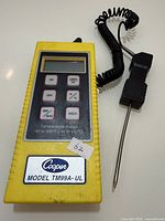 Front view of thermometer showing LCD, control buttons and probe