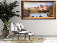 Full room view showing framed landscape painting on wall