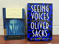 Front covers of both books standing upright