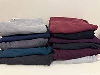 Stacked view of all folded sweatpants