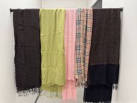 All five scarves hanging side by side to show full front view