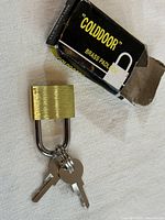 padlock with keys and open box
