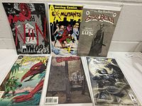 Group shot of all six bagged comics