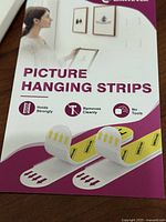 Front of EMITEVER Picture Hanging Strips package