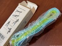 sealed stack of five loop bands beside opened Yongdo box