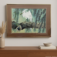 Front view of framed watercolor showing white heron on branch