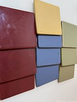 Front view of assorted glazed ceramic coasters showing colors and finish