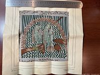 Full view of square textile with ruler for scale