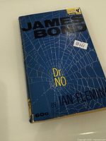 Front cover showing title, spider-web design, 60¢ price and #161 label