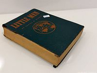 Front and spine view of Little Men hardcover showing cloth boards and wear