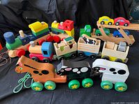 Full group shot showing both train sets, car carrier truck, pull-along animals