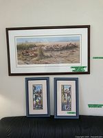 Overall view of large Seerey-Lester print above two smaller prints on wall