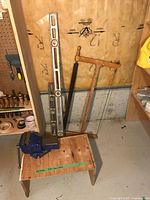 Group shot of vise, bucksaw, two levels