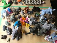 Overview of entire grouping of elephant collectibles on table