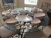 Full lot on glass table showing all CorningWare French White pieces