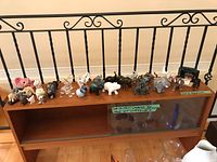 Full shelf view of entire elephant figurine collection