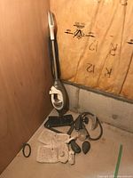 Full view of Shark floor steamer with attachments on floor