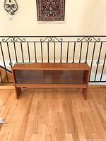 Full view of teak credenza top front
