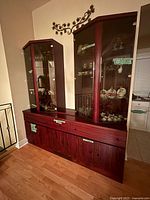 Front view of complete rosewood hutch and buffet set
