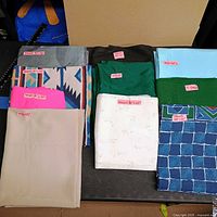 Overview of folded fabric pieces on table