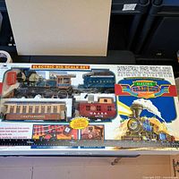 Front of boxed electric big scale train set showing all components