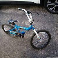 Full right-side view of blue Huffy 20" bicycle
