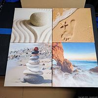 Front view of four beach-themed canvas prints