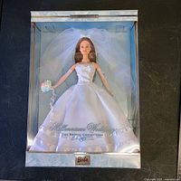 Front view of boxed Millennium Wedding Barbie doll showing gown, veil, bouquet and collection title