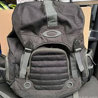 Front view showing overall design, molded panel, logo, grommets and zippers