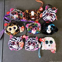 All nine Ty Fashion wristlet purses displayed in three rows