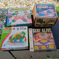 Group shot showing all four boxed games on tables