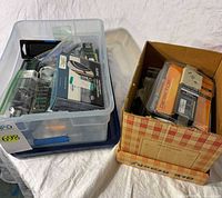 Overall view of tote of RAM, ClearSounds package, and box of parts