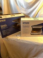Both Epson scanner boxes V500 and V600 side by side