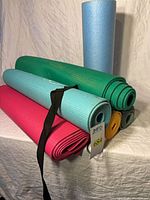 Stacked mats and blue foam roller