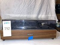 Front view of Pioneer PL-12D turntable with dust cover closed