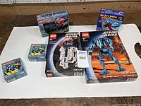 All five boxed LEGO sets displayed on table