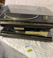 Stacked pair of Technics SL-QD33 turntables with dust covers closed