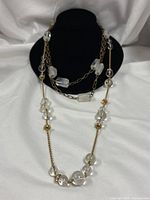 Both necklaces displayed on bust