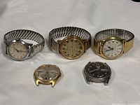 Group shot of all five wristwatches