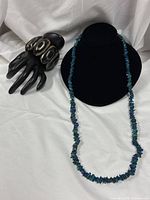 Necklace on bust and bracelet on hand display